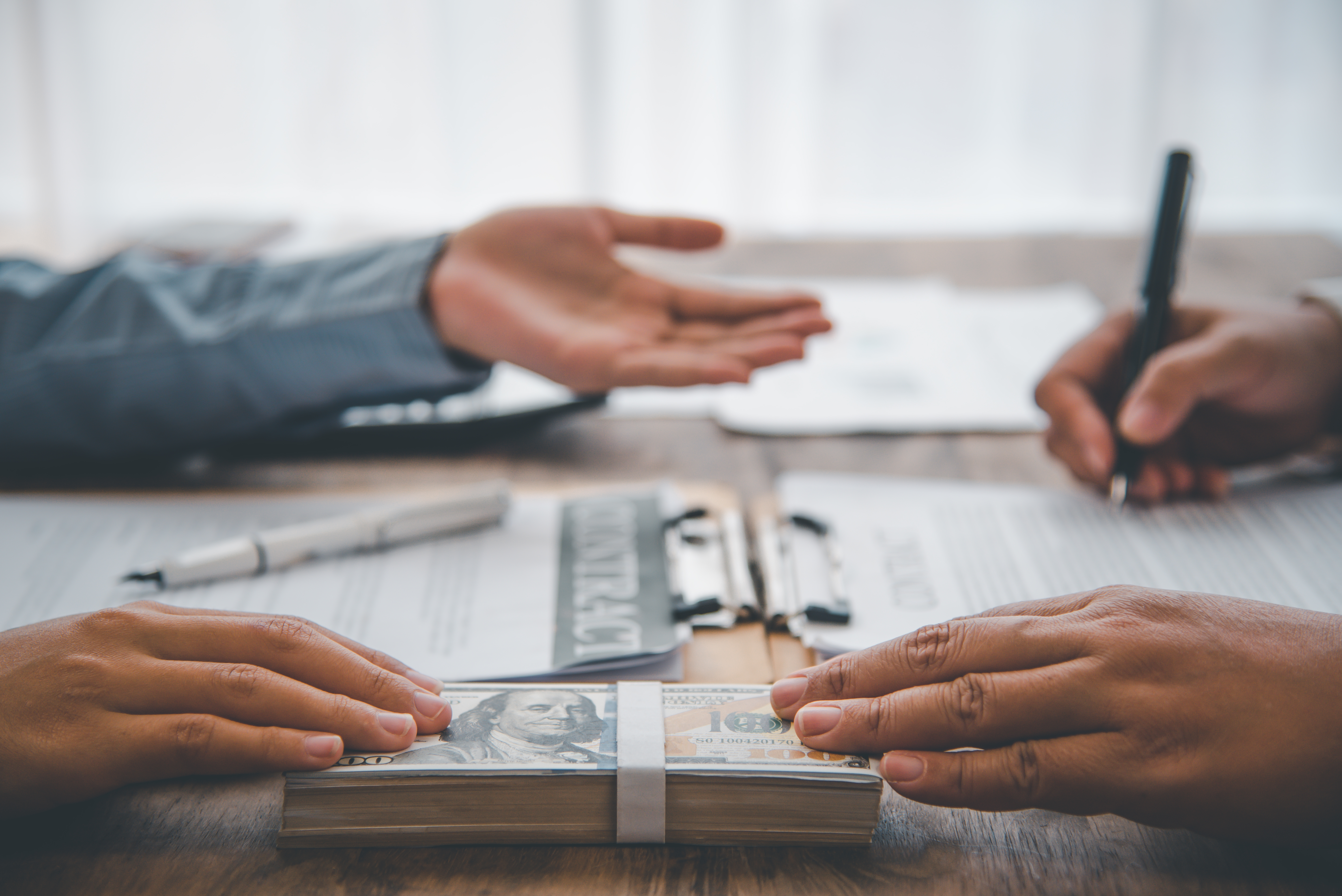 Business owner negotiating a loan restructuring agreement