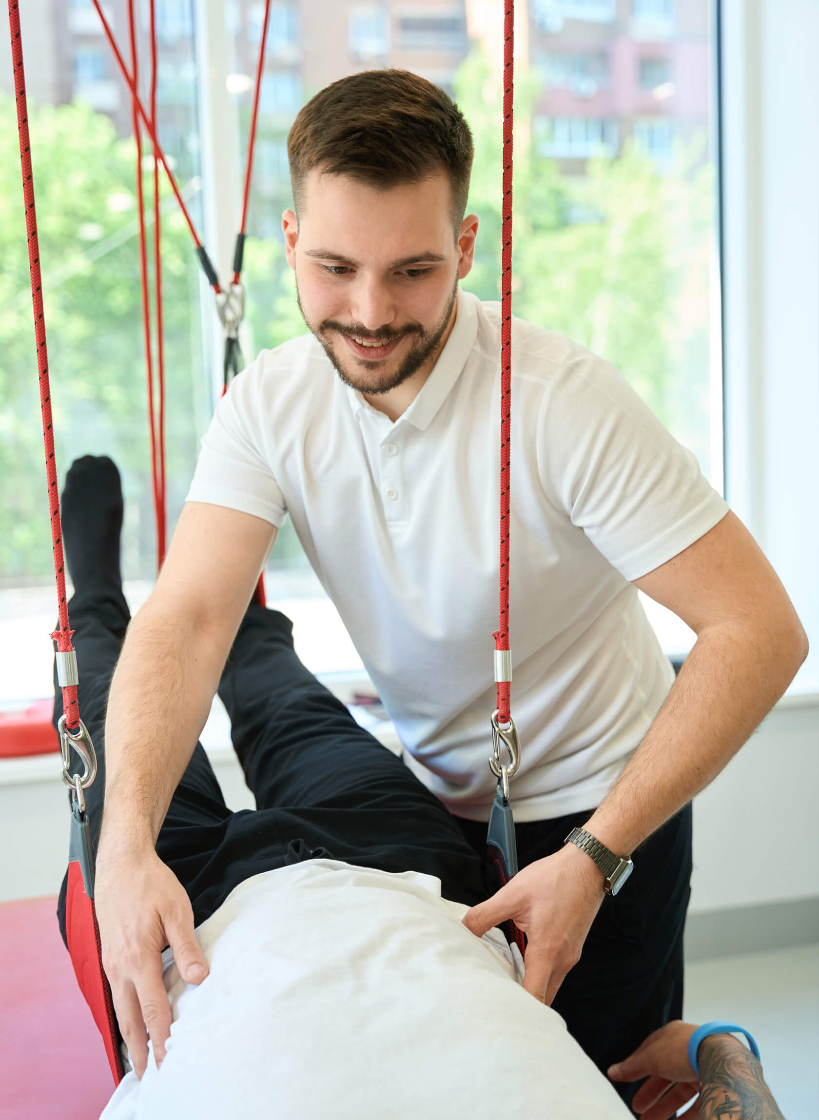 Rehabilitation expert working with a patient.