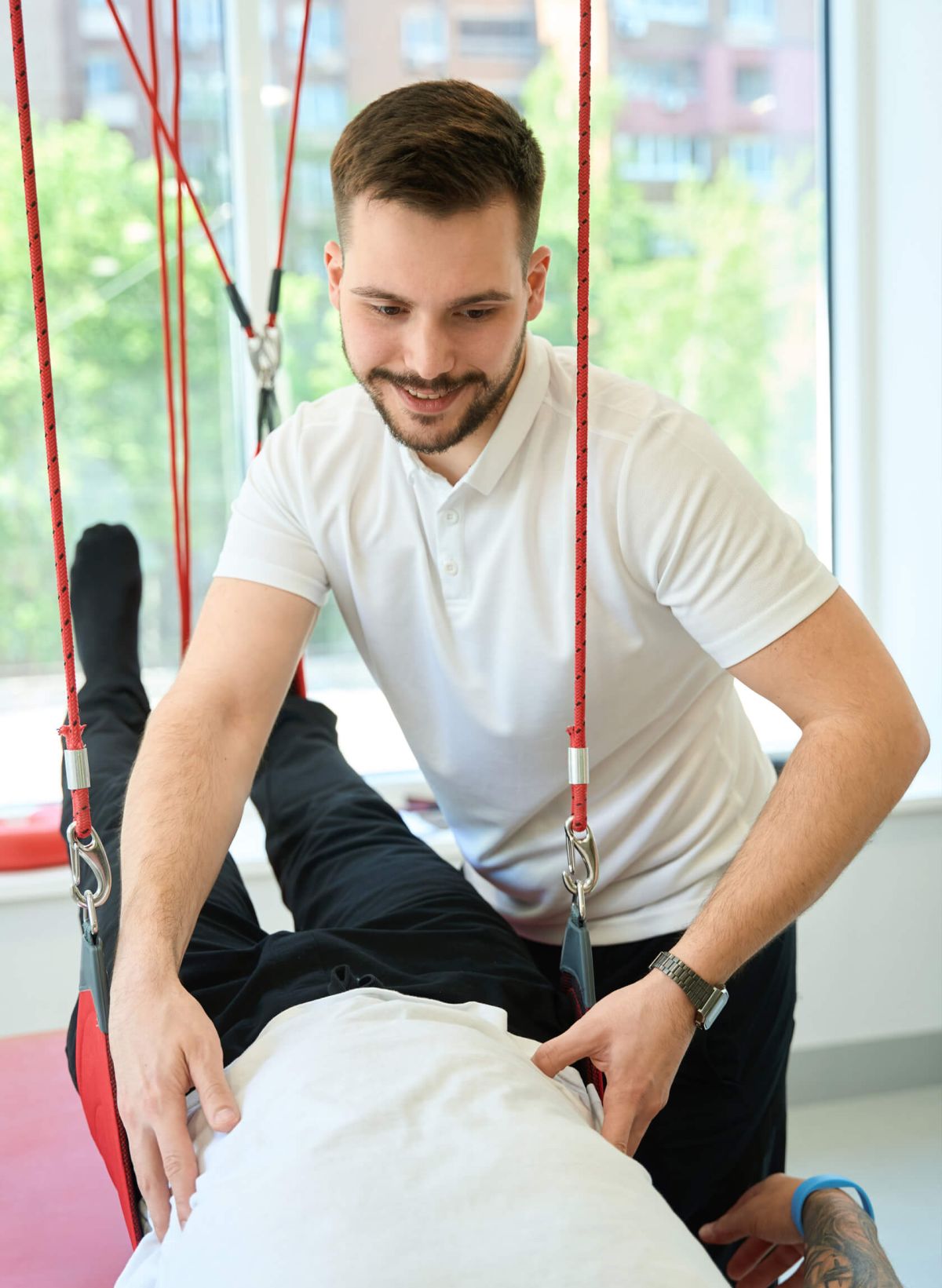 Rehabilitation expert working with a patient.